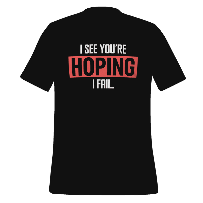 Black t-shirt with humorous text design on a green background