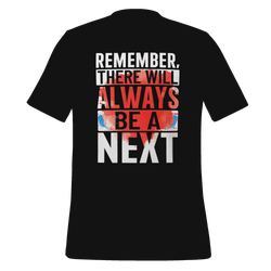 Black t-shirt with motivational quote on the back against a green background