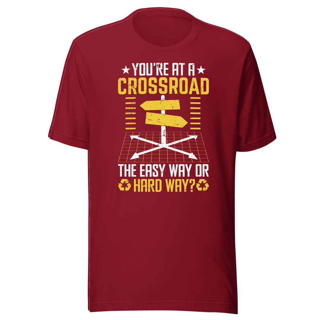 Red t-shirt with yellow and white graphic and text on a green background