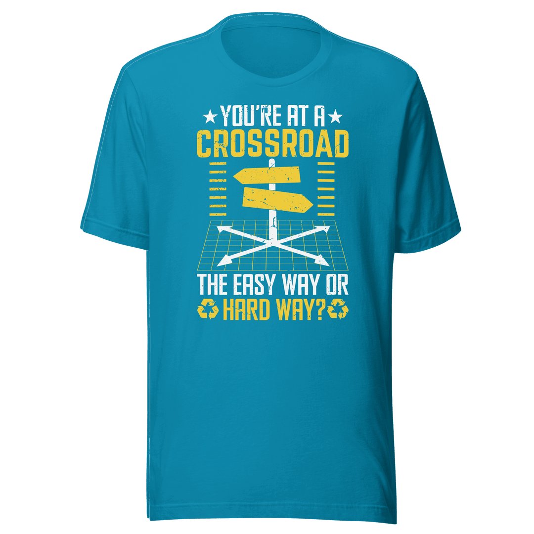 Blue t-shirt with motivational quote graphic on a green background